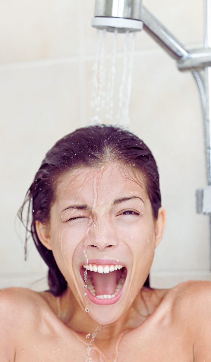 woman experiencing unpleasant shower
